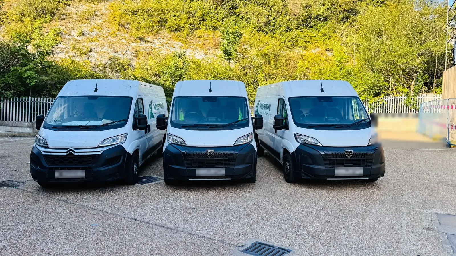 Three delivery vans loaded and ready for next-day scheduled routes